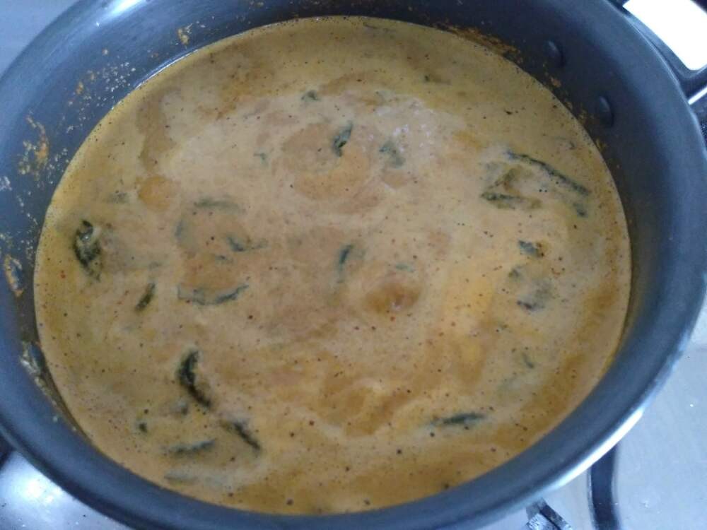 Malabar Spinach Curry boiling in a curry pot